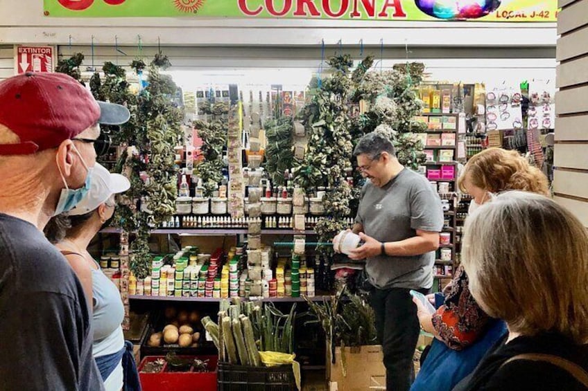 A store with a variety of products on shelves, including plants and bottles. 5