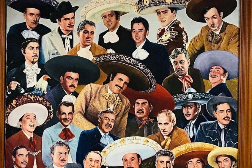 A group of people in traditional Mexican attire, including sombreros and formal suits. 2