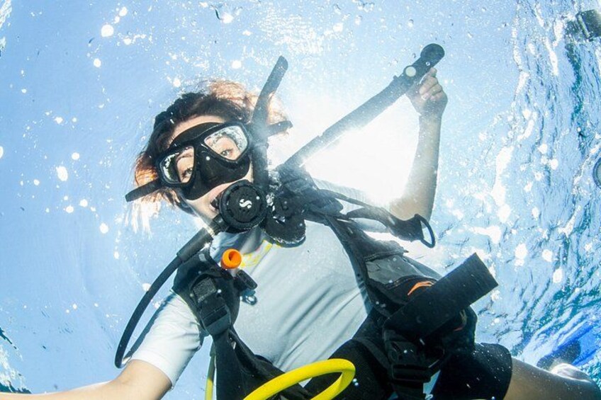 A person scuba diving with a mask, snorkel, and fins. 5