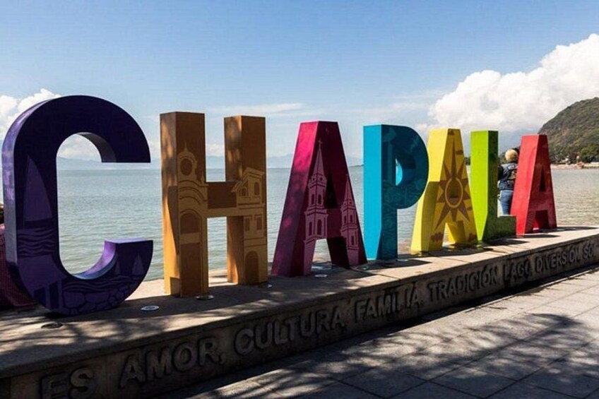 Colorful letters spelling 'CHAPALA' with a beach and ocean in the background. 5