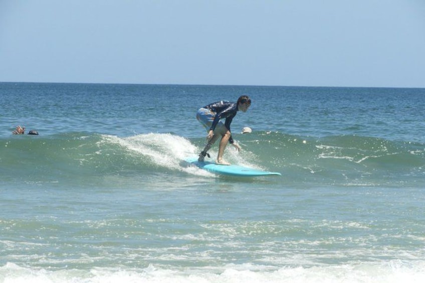 A person surfing on a wave in the ocean. 3