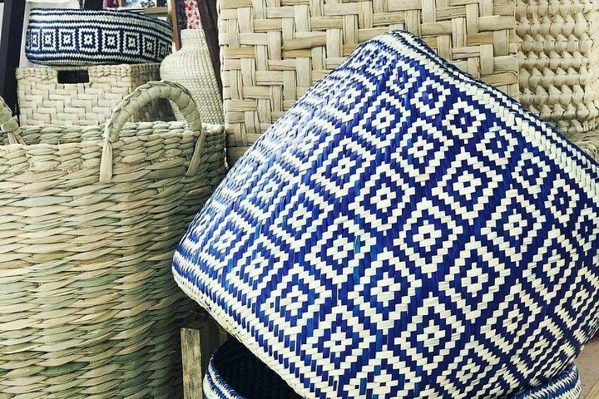 Woven baskets and a blue patterned cushion. 5