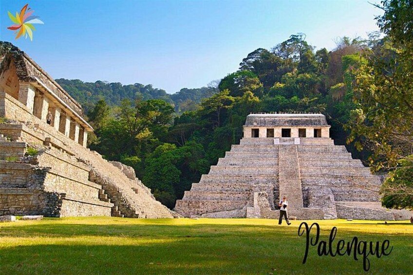 A large ancient pyramid structure surrounded by lush greenery. 3
