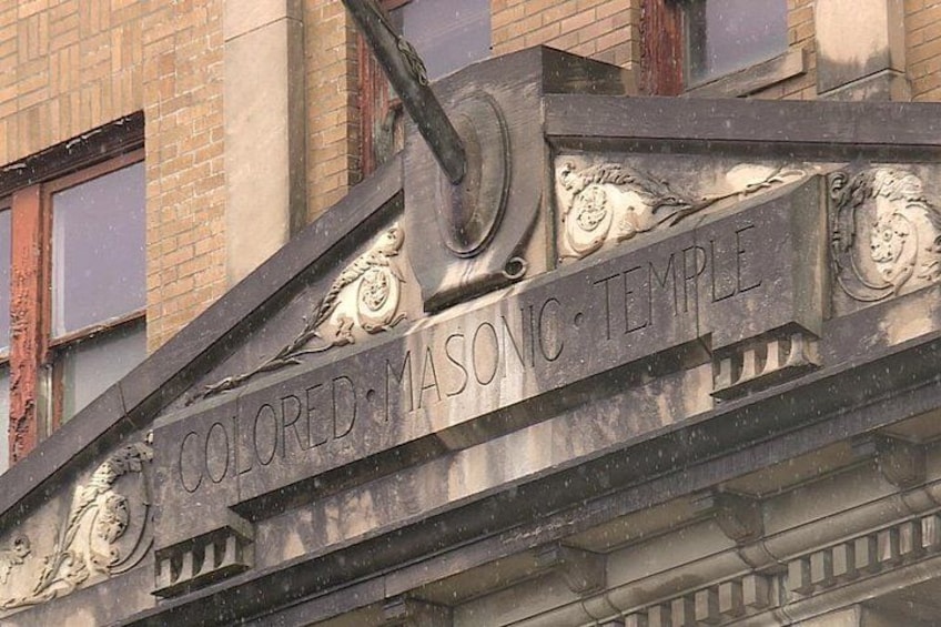 A building facade with the inscription 'Colored Masonic Temple'. 2
