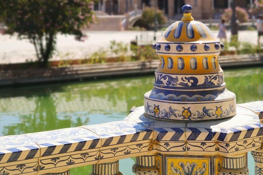 A decorative fountain with a tiered structure and intricate patterns. 3