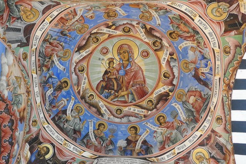 A detailed mosaic with religious figures and inscriptions. 3