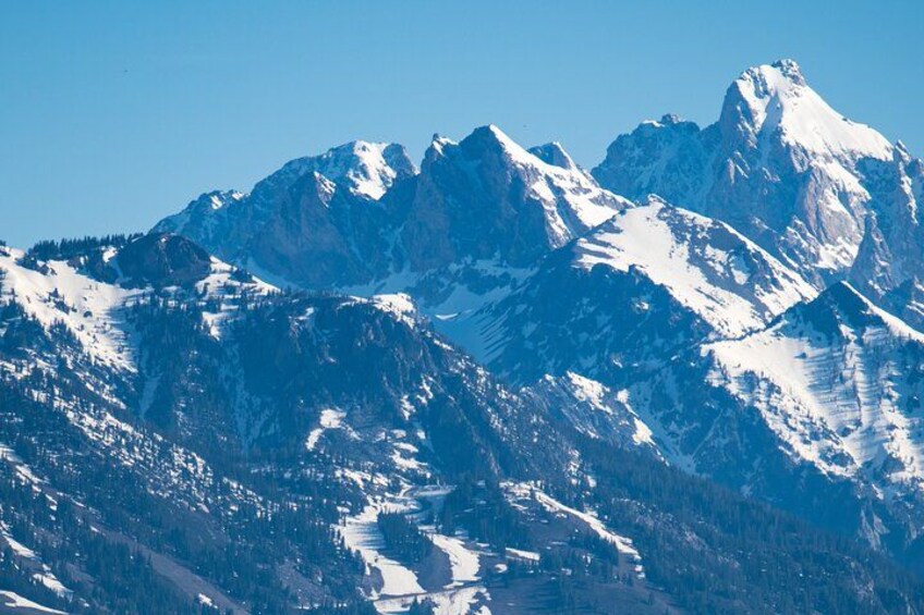 Snow-covered mountain peaks with a clear sky. 3