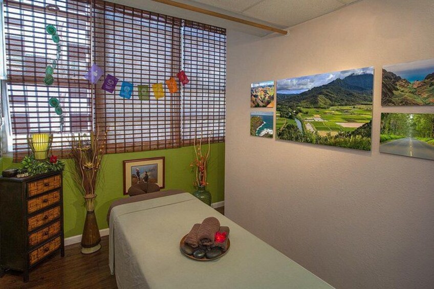 A room with a bed, a wooden dresser, a window with blinds, and wall art. 4