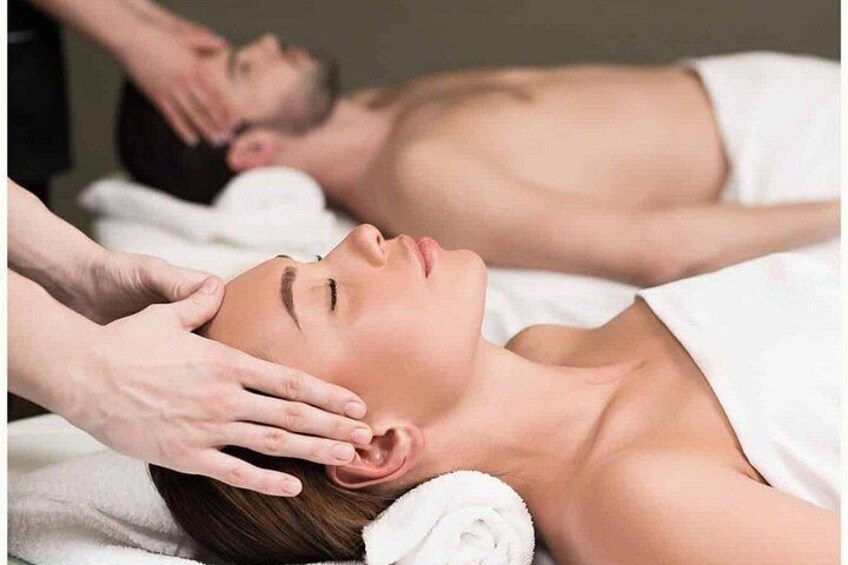 A person receiving a head massage. 2