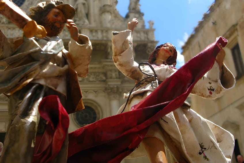 A statue of a man with a red cloak. 1