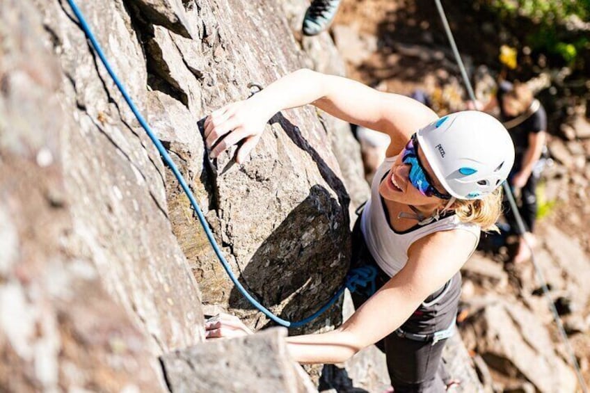 A person climbing a rocky mountain. 1