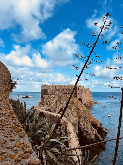 A coastal fortification with a clear sky and calm sea. 4