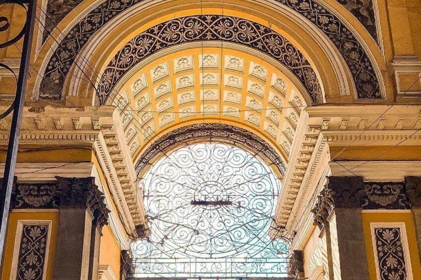 An ornate architectural structure with a large, circular stained glass window and intricate metalwork. 3