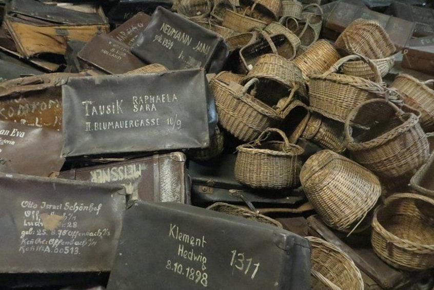 A collection of old baskets with handwritten labels. 3