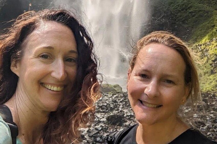 Two people in front of a waterfall. 5