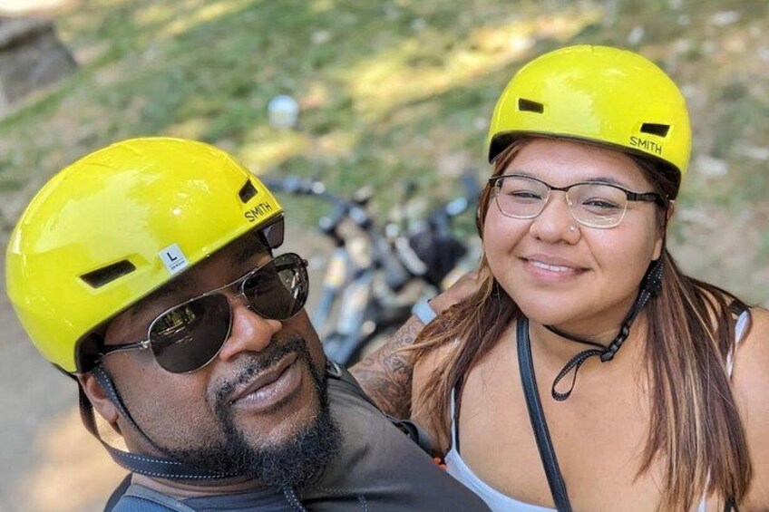 Two people wearing yellow helmets, one with a 'L' and the other with 'SMITH' on it. 3