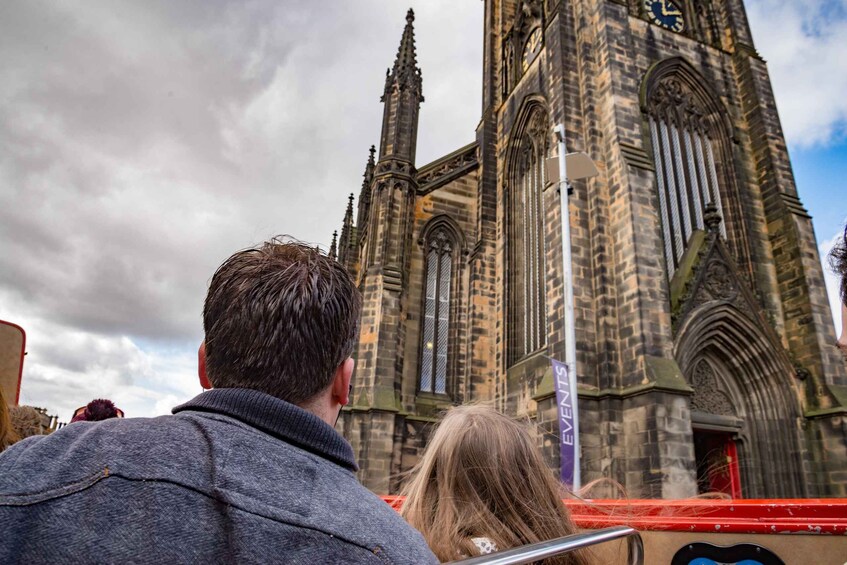 A historic church with a clock tower and Gothic architecture. 4