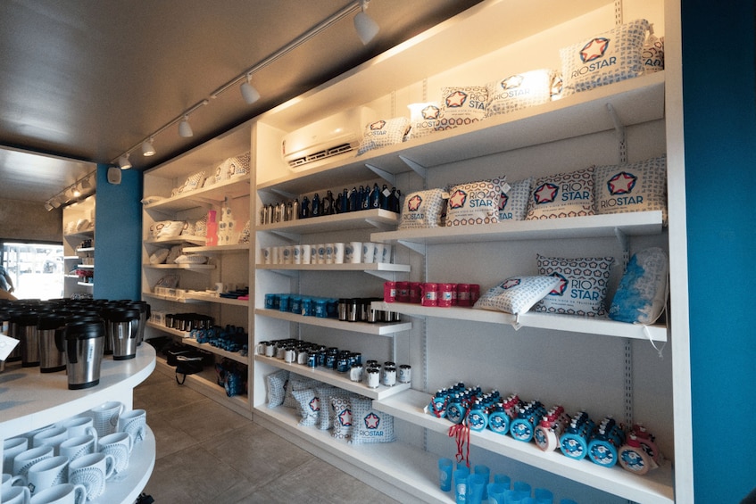 A store interior with shelves stocked with products, including bags, bottles, and containers. 2