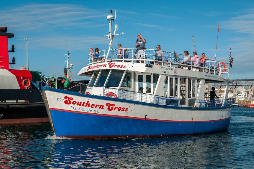 A boat named 'Southern Cross' with passengers on deck. 4