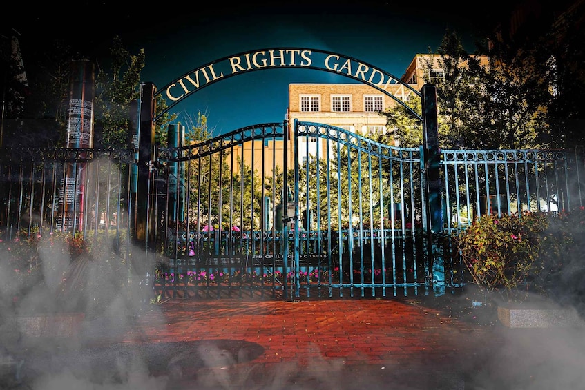 A gated entrance with a sign reading 'Civil Rights Garden'. 5