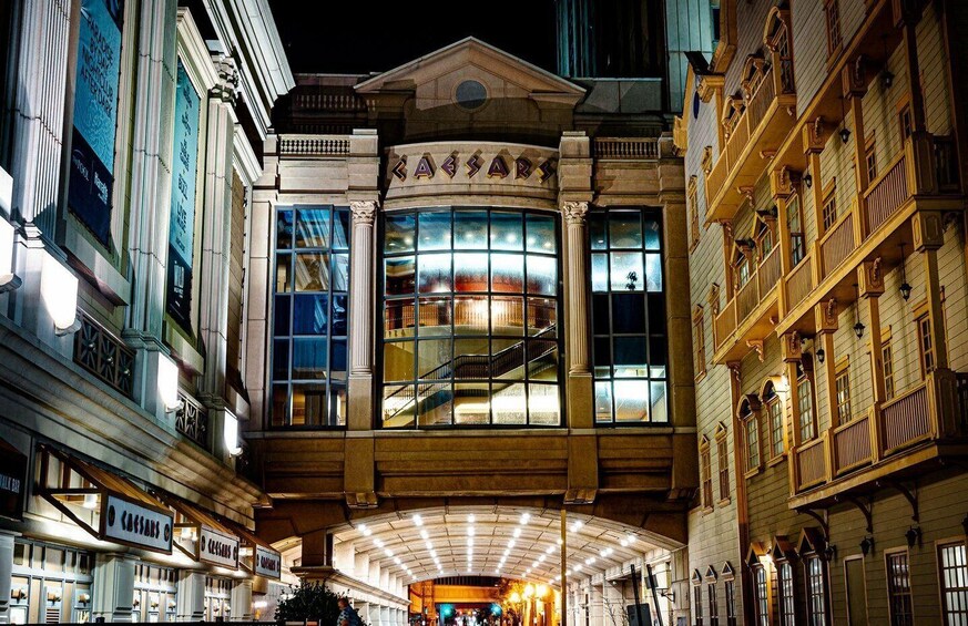 A grand building with large windows and a central staircase. 1