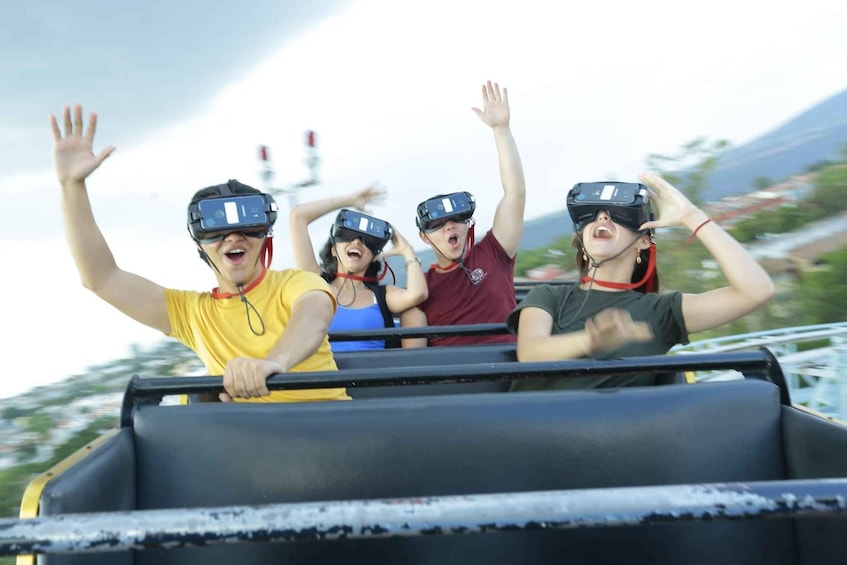 People in a moving vehicle with VR headsets, enjoying a ride. 5