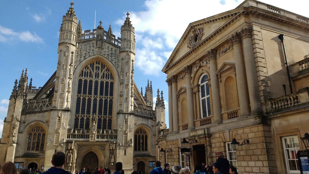 A historic building with Gothic architecture and a clock tower. 1