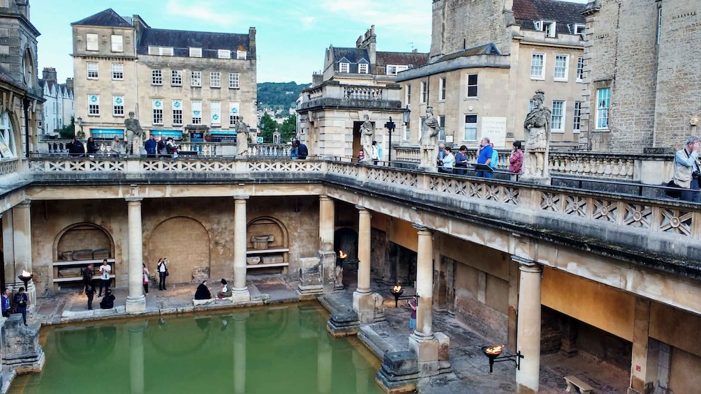 A historical bridge with a central water feature, surrounded by classical architecture. 3