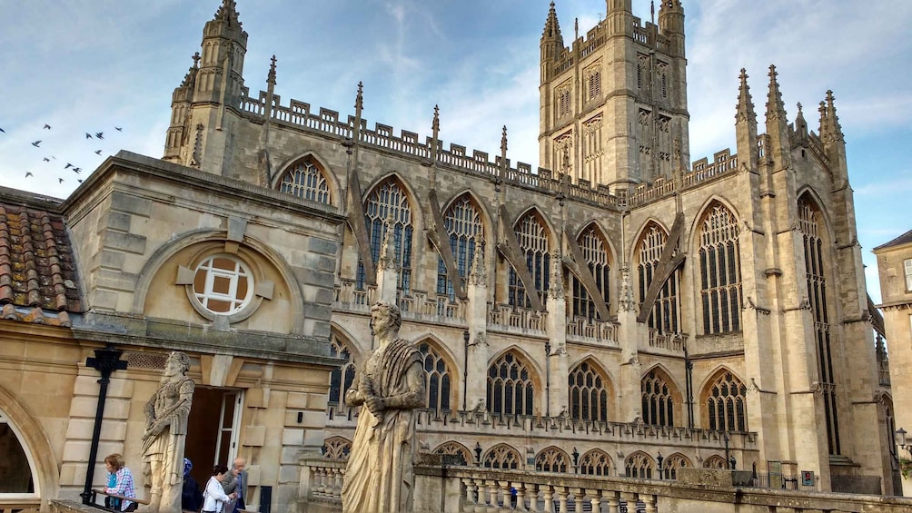 A historic cathedral with Gothic architecture, including pointed arches and a large clock tower. 4