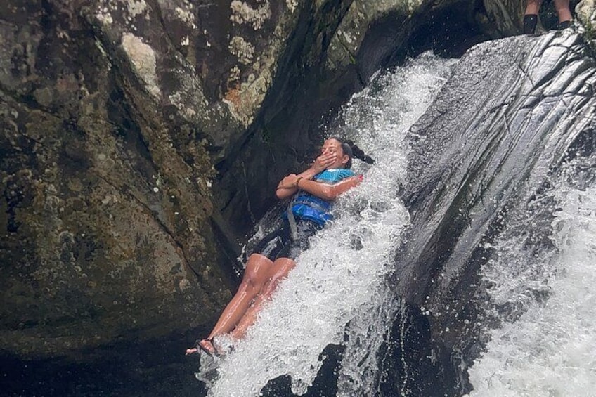 A person sliding down a waterfall. 1