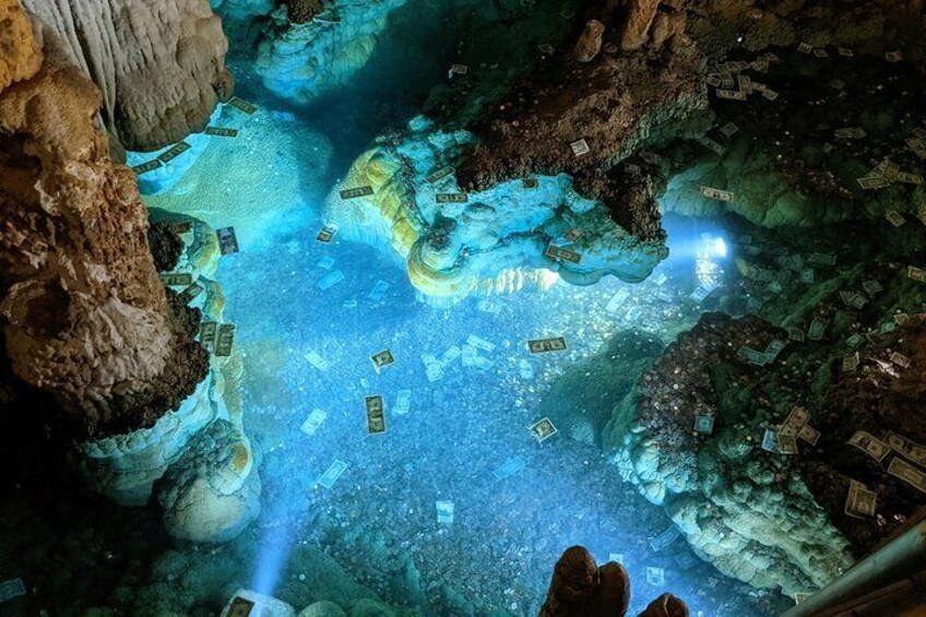 An underwater cave with stalactites and stalagmites, illuminated by artificial lighting. 2