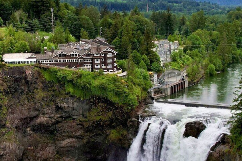 A waterfall, a dam, and a building with a river. 5