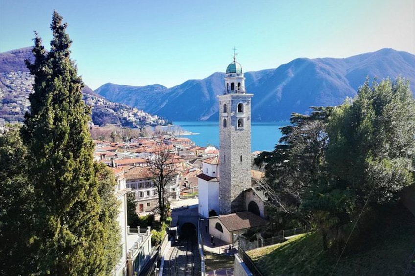 A tower, a lake, and a town. 4