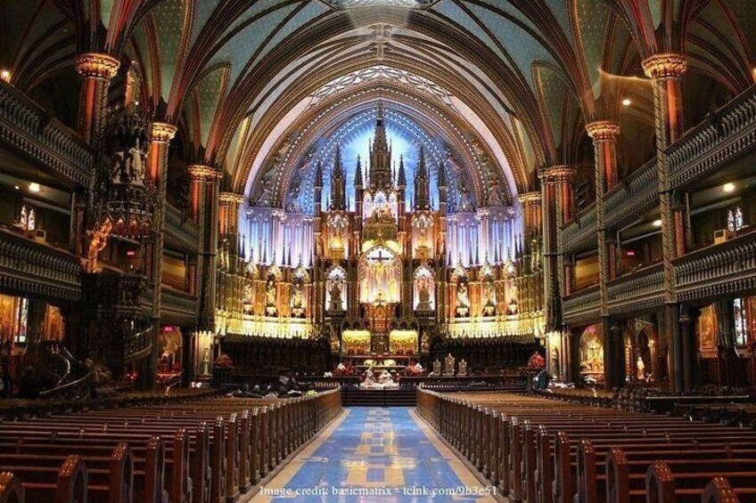 A grand cathedral interior with high vaulted ceilings, ornate stained glass windows, and a central altar. 2