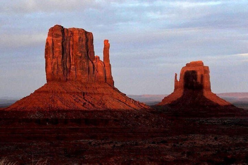 Two prominent rock formations in a desert landscape. 4