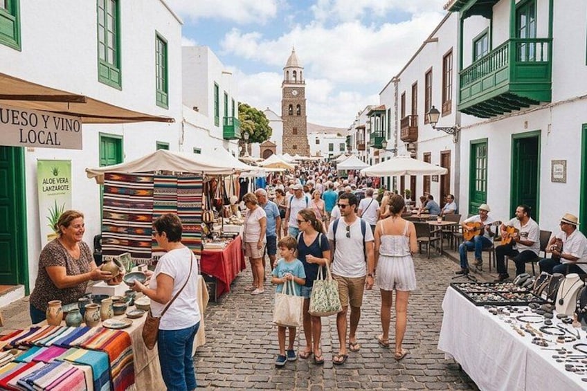 A bustling outdoor market with people shopping and vendors selling goods. 5
