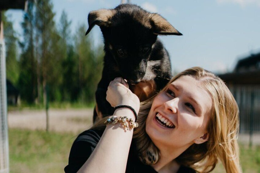 A person holding a dog. 4