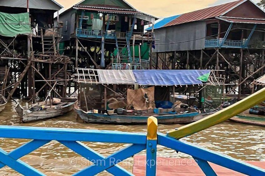 A waterway with floating houses and boats. 2