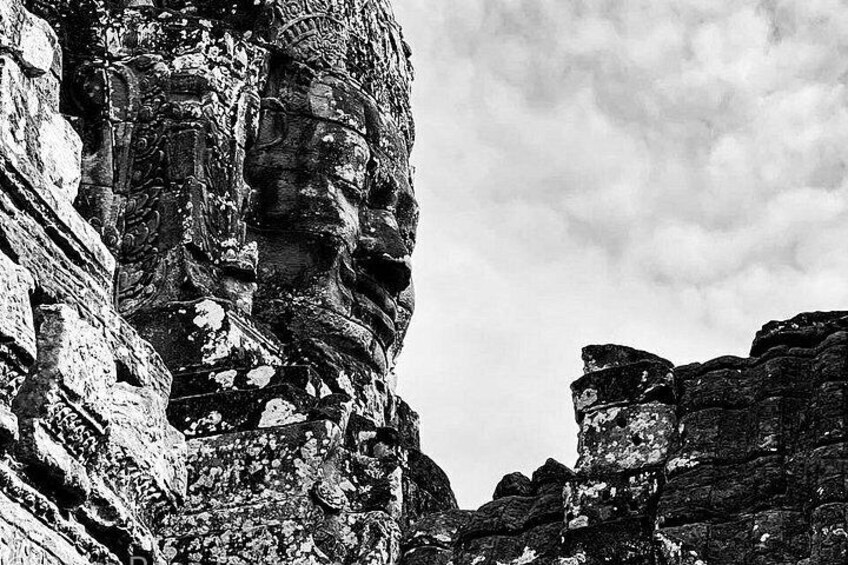 Ancient stone ruins with intricate carvings and weathered surfaces. 3