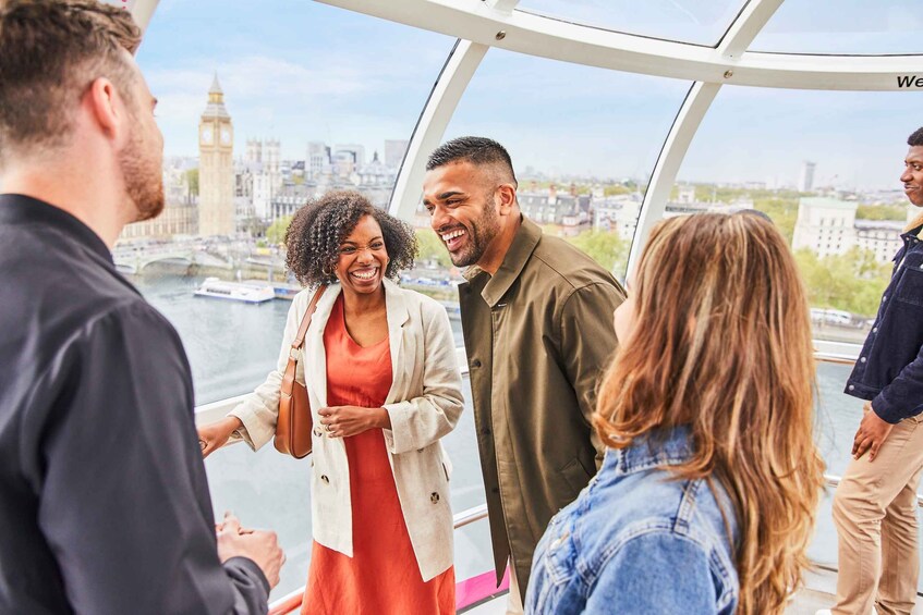 A group of people on a glass-bottomed boat tour, overlooking a cityscape with a prominent clock tower. 5