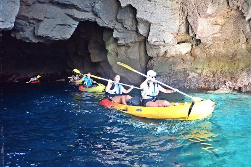 People kayaking in a cave. 1