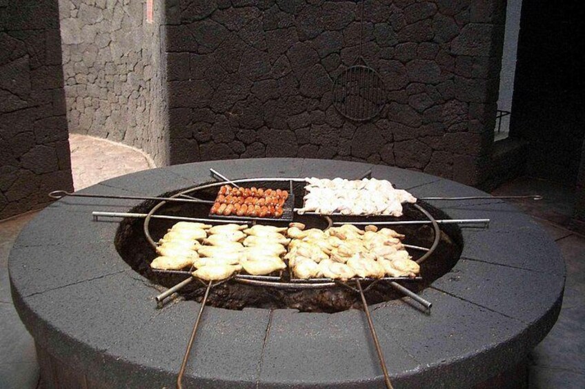 A stone wall with a circular grill in the center. 5