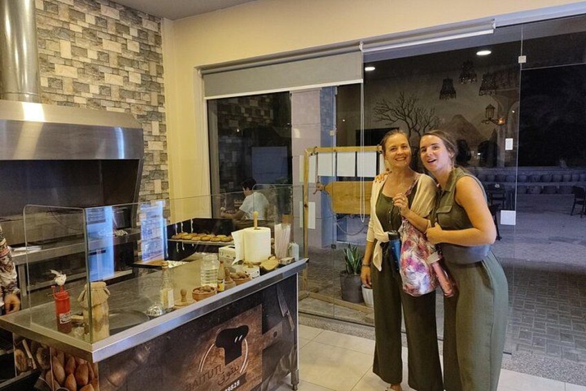 A kitchen counter with food items and a large oven. 5