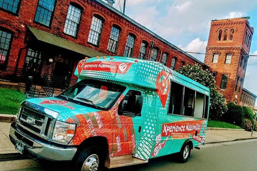 A food truck with a colorful design parked on a street. 4