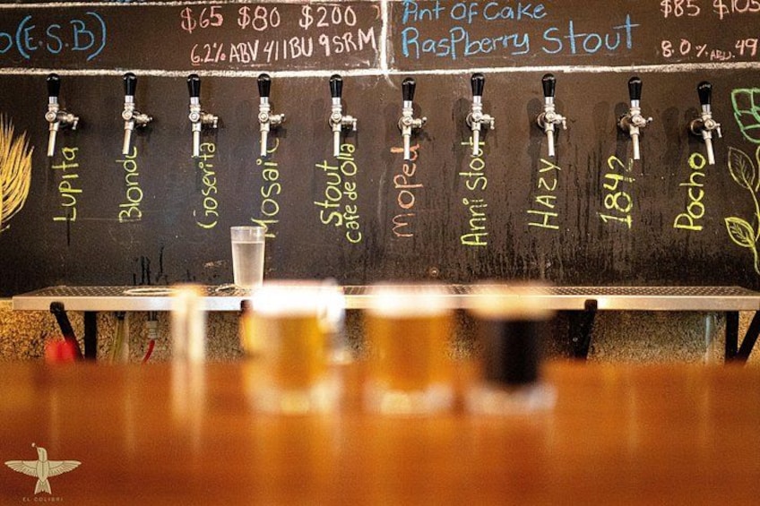 A tap board with various beer names and prices. 5