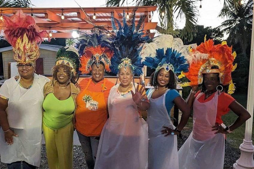 A group of people in colorful costumes and feathered headdresses. 5