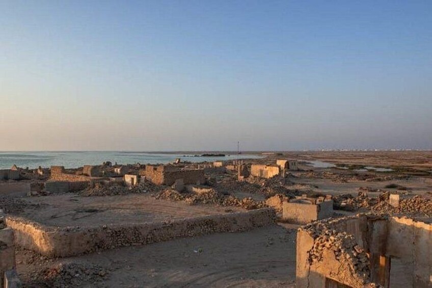 Ancient ruins by a coastal area with clear skies. 3