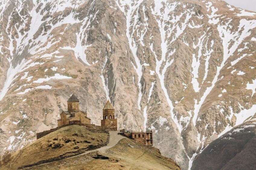 A mountain with a small church on a hill. 3