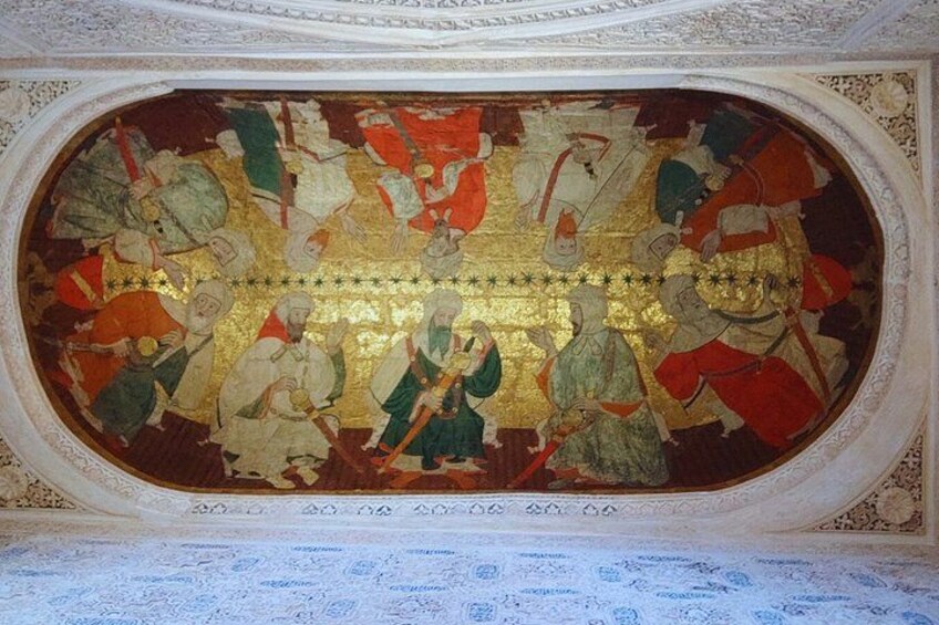 A detailed fresco with figures in historical attire, set within an ornate architectural space. 4