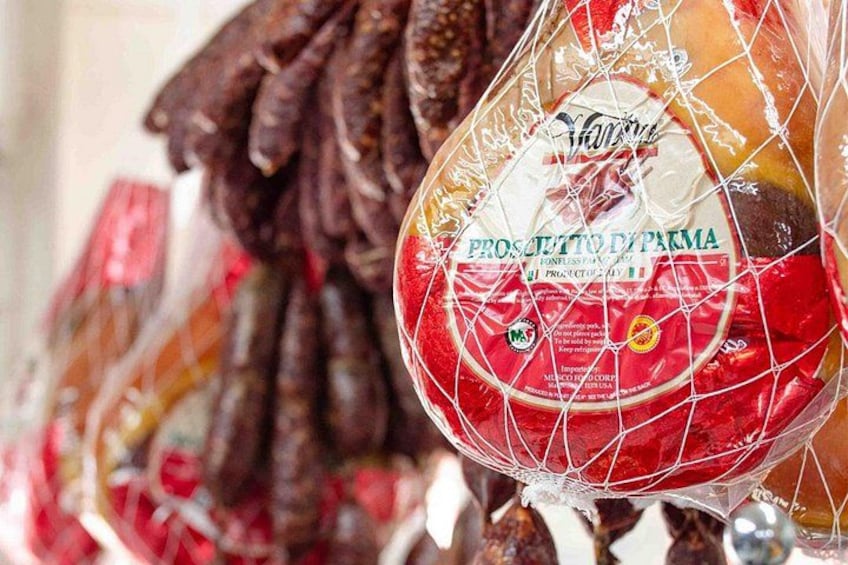 A packaged food item with a label that reads 'PROSCETTO DI PARMA.' 2